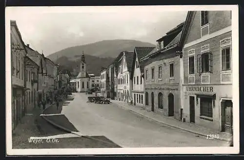 AK Weyer /O.-Oe., Strassenpartie mit Uhrmacher und Kirche
