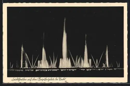 AK Düsseldorf-Schlageterstadt, Grosse Reichsausstellung Schaffendes Volk 1937, Hauptfestplatz u. Leuchtfontäne bei Nacht