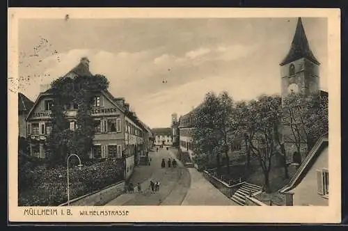 AK Müllheim, Wilhelmstrasse mit Leuten