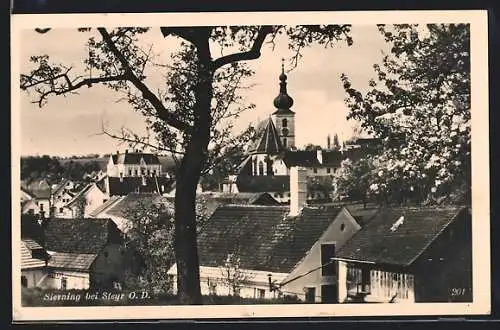 AK Sierning bei Steyr, Ortspartie mit der Kirche über Dächer hinweg