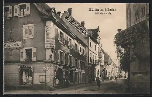 AK Müllheim /Baden, Wilhelmstrasse mit Geschäftshaus Schmidt und Hotel Löwen
