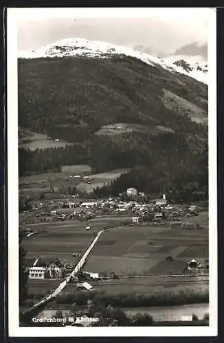 AK Greifenburg, Ortsansicht gegen die verschneiten Berge