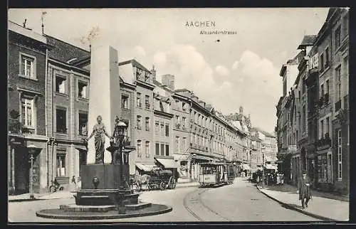 AK Aachen, Alexanderstrasse mit Geschäften, Brunnen und Strassenbahn