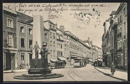 AK Aachen, Alexanderstrasse mit Geschäften, Brunnen und Strassenbahn