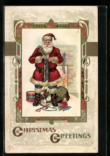 AK Weihnachtsmann stopft Socken mit Geschenken voll