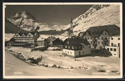 AK Galtür, Ortsansicht mit dem Alpenhaus Fluchthorn im Schnee