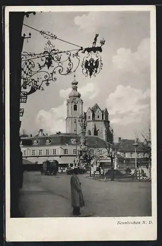 AK Neunkirchen /N.-D., Strassenpartie mit Kirche