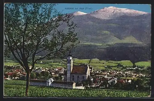 AK Absam bei Hall, Ortsansicht mit der Kirche gegen die Berge