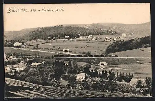 AK Dürrwien, Ortsansicht mit Feldern, Eisenbahn und Bergpanorama aus der Vogelschau