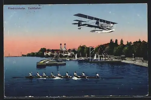 AK Friedrichshafen, Doppeldeckerflugzeug über dem Yachthafen
