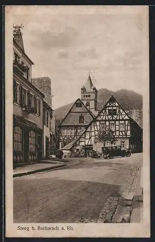 AK Steeg b. Bacharach, Ortspartie mit alten Fachwerkhäusern und Kirchturm