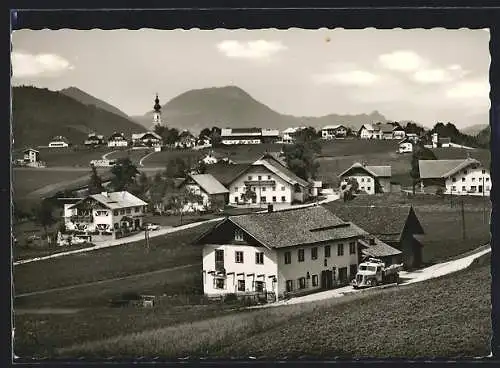 AK Faistenau bei Sbg., Blick auf die verstreute Ortschaft gegen die Berge
