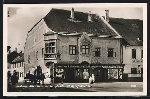 AK Eggenburg, Altes Haus am Hauptplatz mit Sgrafitomalerei, Warenhaus Geppert