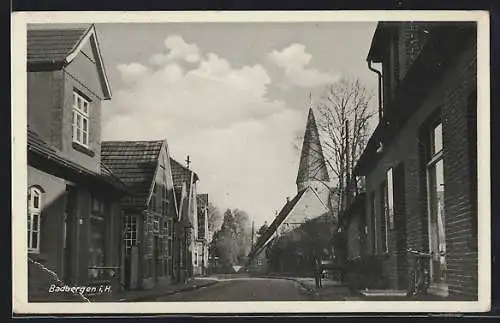 AK Badbergen i. H., Strassenpartie mit Blick zur Kirche