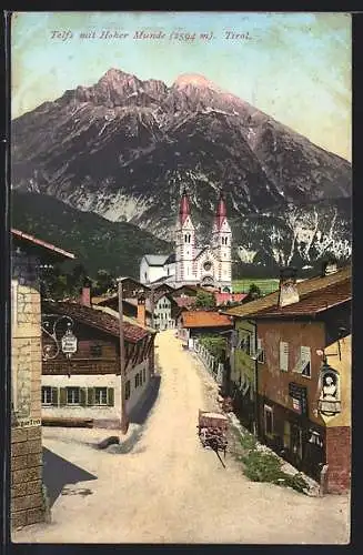 AK Telfs, Strassenpartie am Gasthof Hunde Munde mit Hohe Munde