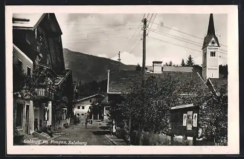 AK Goldegg im Pongau, Strassenpartie mit Kirche