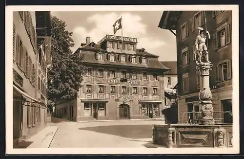 AK Zug, Strassenpartie mit Hotel Hirschen, Schweizer Flagge