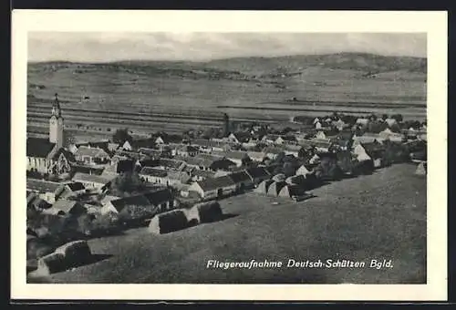 AK Deutsch-Schützen, Ortsansicht mit Kirche, Fliegeraufnahme