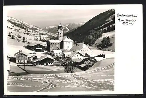 AK Saalbach, Ortspartie mit Kirche im Winter