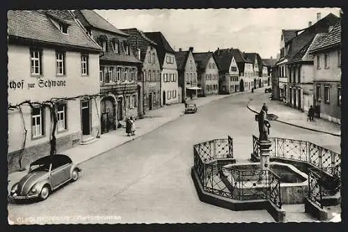 AK Gerolzhofen /Ufr., Strassenpartie mit Gasthof zur Schwane und Florianbrunnen