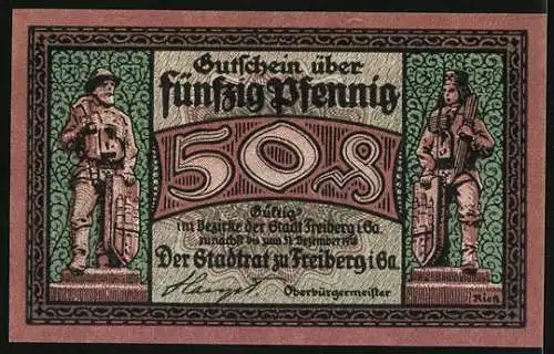 Notgeld Freiberg i. Sa. 1918, 50 Pfennig, Figuren mit Schild, Arbeiter mit Lore vor Ortspanorama