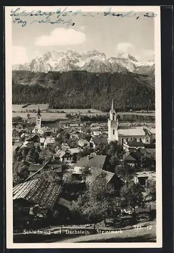 AK Schladming /Steiermark, Ortsansicht mit Kirche gegen Dachstein