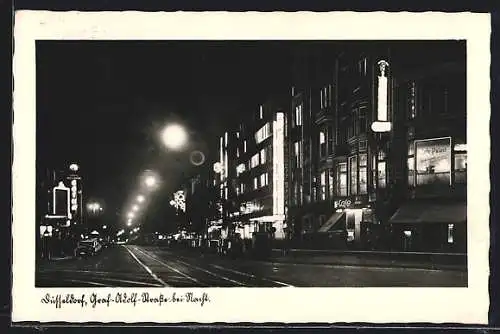 AK Düsseldorf, Graf-Adolf-Strasse mit Palast-Cafe bei Nacht