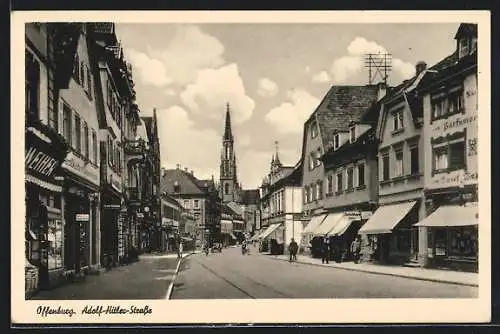 AK Offenburg, Strasse mit Kirche und Geschäften