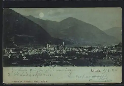 Mondschein-AK Brixen, Ortsansicht gegen das Gebirge