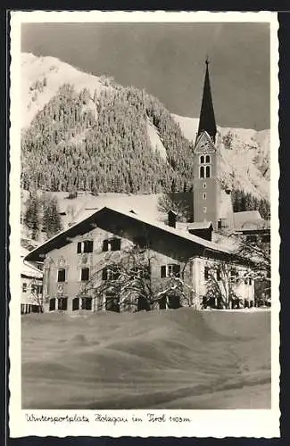 AK Holzgau in Tirol, Teilansicht mit Kirche im Winter