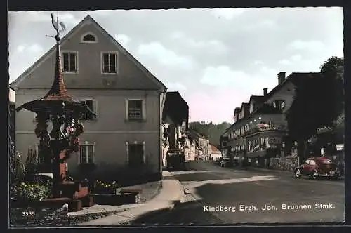 AK Kindberg, Steiermark, Strassenpartie mit Erzh. Joh. Brunnen