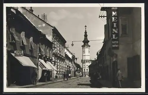 AK Radkersburg in Steiermark, Strassenpartie mit Geschäft Marie Blum und Uhrturm