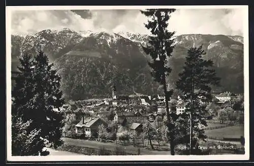 AK Spittal a. d. Drau, Ortsansicht hinter Tannen mit Goldeck