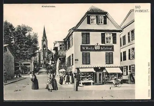 AK Bad Pyrmont, Kirchstrasse mit Geschäft W. Weitz und Kirche