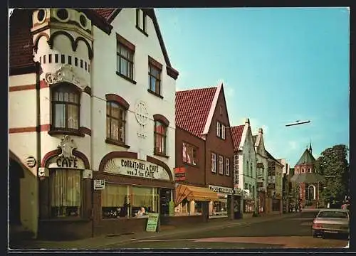 AK Norden / Nordsee, Osterstrasse mit Blick auf Ludgerikirche, Cafè ten Cate