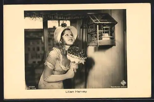 AK Schauspielerin Lilian Harvey mit einem Blumenstrauss