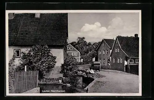 AK Lauter /Mainfranken, Dorfstrassenpartie mit Auto