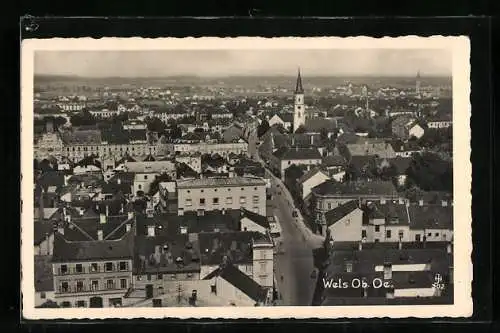 AK Wels /Ob.-Oe., Teilansicht mit Kirche und Strassenpartie