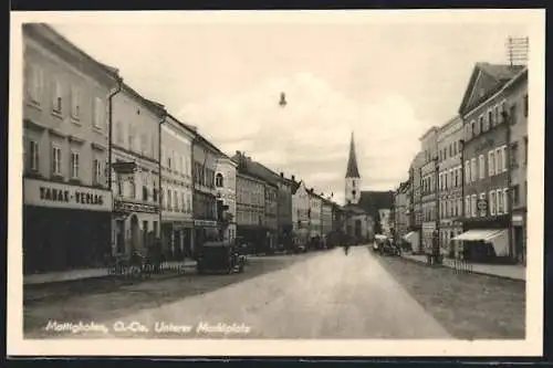 AK Mattighofen, Unterer Marktplatz mit Kirche und Geschäften, Tabak-Verlag