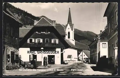 AK St. Johann am Tauern, Strassenpartie mit Blick auf den Kirchturm