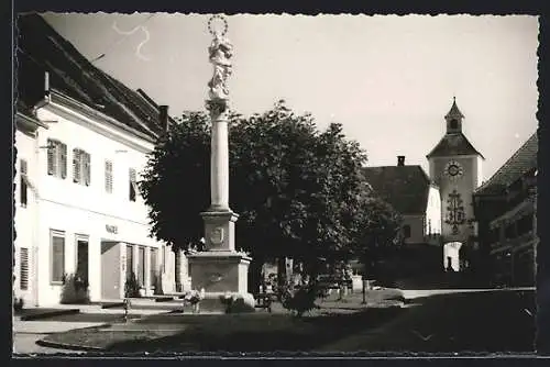 AK Obdach, Strassenpartie mit Kirche und Denkmal