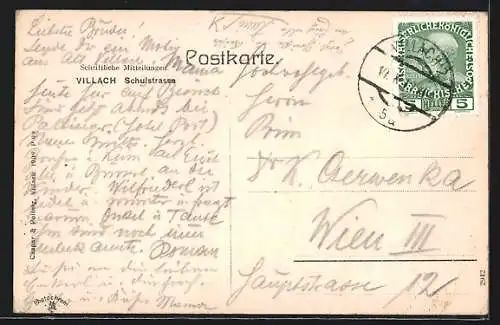 AK Villach, Schulstrasse mit Geschäften und Kirche