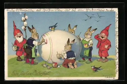 Künstler-AK F.Baumgarten: Ein frohes Osterfest!, Osterhasen bemalen ein riesiges Ei