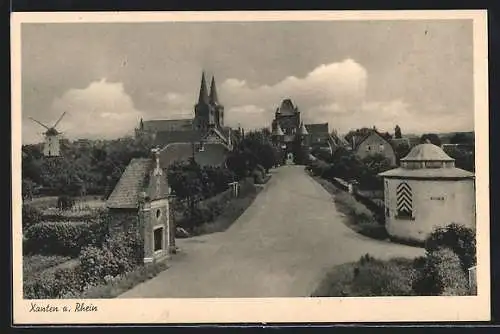 AK Xanten a. Rhein, Strassenpartie mit Kirche und Windmühle