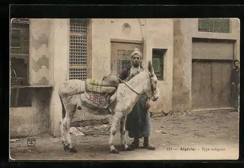 AK Algerien, Gesattelter Esel mit seinem Besitzer