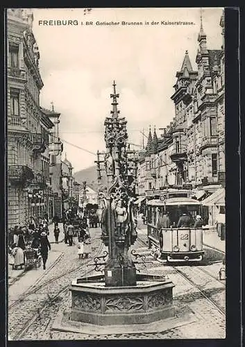 AK Freiburg i. Br., Gotischer Brunnen und Strassenbahn in der Kaiserstrasse