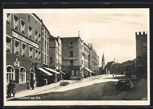 AK Mühldorf / Inn, Strassenansicht mit Hotel-Restaurant Josef Dinhuber und Kirchturm