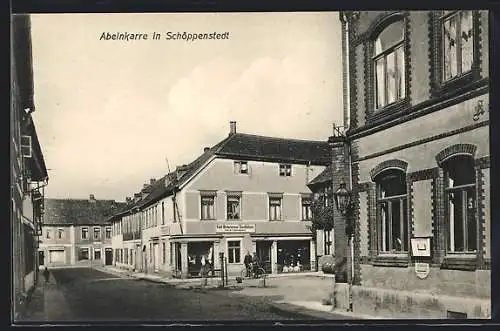 AK Schöppenstedt, Abelnkarre mit Geschäftshaus Carl Heinemann Nachfolger, Strassenpartie