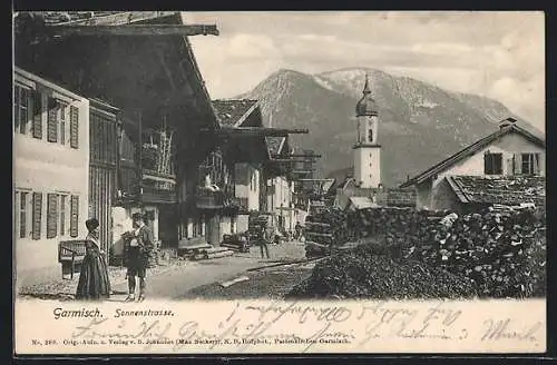 AK Garmisch, Sonnenstrasse mit Kirche