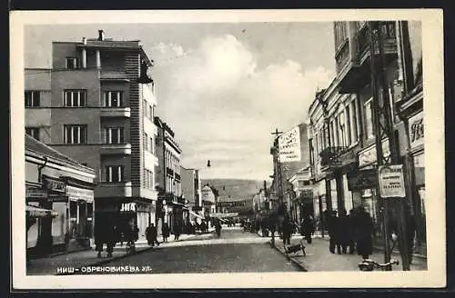 AK Nisch, Strassenpartie mit Geschäften